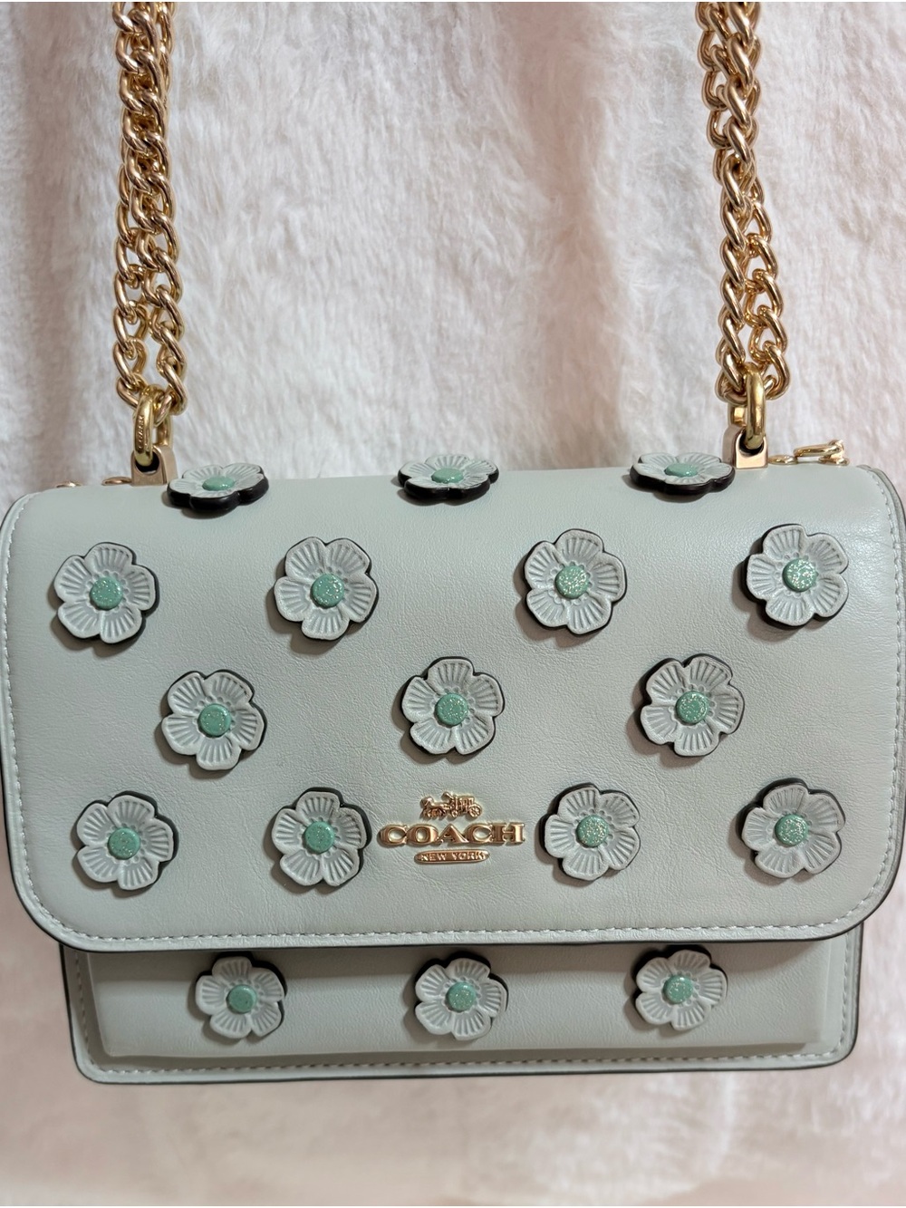Coach Mini Klare crossbody bag features soft green leather accented with delicat
